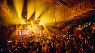 A crowd of people enjoying a musical concert.